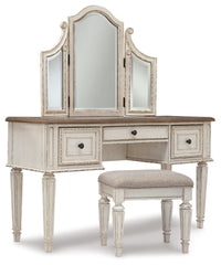 Realyn Queen Upholstery Panel Bed, Dresser, Chest, Nightstand, and Vanity Set