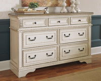 Realyn Queen Upholstery Panel Bed, Dresser, Chest, Nightstand, and Vanity Set